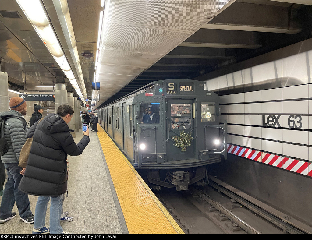 Somebody else snapping footage of the Holiday Train at Lexington Av-63 St Sta